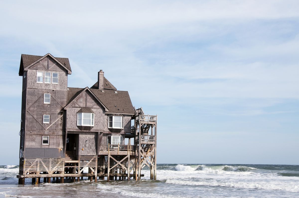 <p>Does this oceanfront vacation home look familiar to you? If it does, you might have seen it in the 2008 Nicholas Sparks film starring Richard Gere and Diane Lane, <em>Nights in Rodanthe</em>. The <a href="http://www.sunrealtync.com/inn-rodanthe-hatteras-islands-most-celebrated-vacation-rental">Inn at Rodanthe</a> was built in the 1980s, when it originally stood 400 feet from the Atlantic Ocean. But the water crept ever closer and the home was put in great danger, so it was moved to this location in 2010, where it's now available to rent. </p>