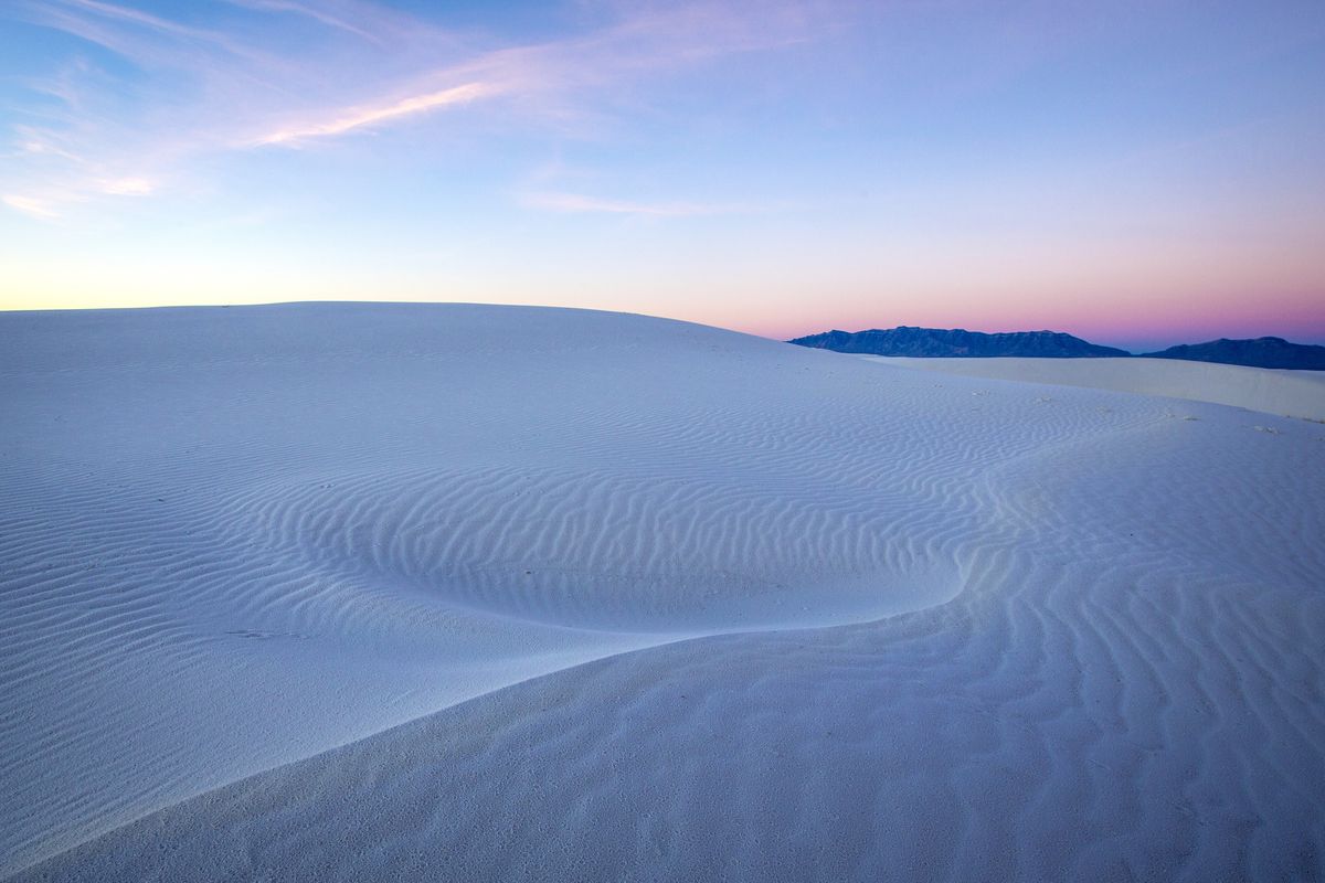 <p>Although photos of New Mexico's rolling white sand dunes look almost too fantastic to be real, visitors can indeed find the <a href="https://www.nps.gov/whsa/index.htm">White Sands National Monument</a> in the heart of the Tularosa Basin. The sand is made of gypsum, which gives it its clean white color, and covers 275 square miles of desert. The photo opps — and opportunities for activities like sledding and hiking — are endless.</p><p><em><a href="http://www.housebeautiful.com/lifestyle/g2833/beautiful-places-in-nature/">See more places in nature so beautiful you won't believe they're real.</a></em></p>