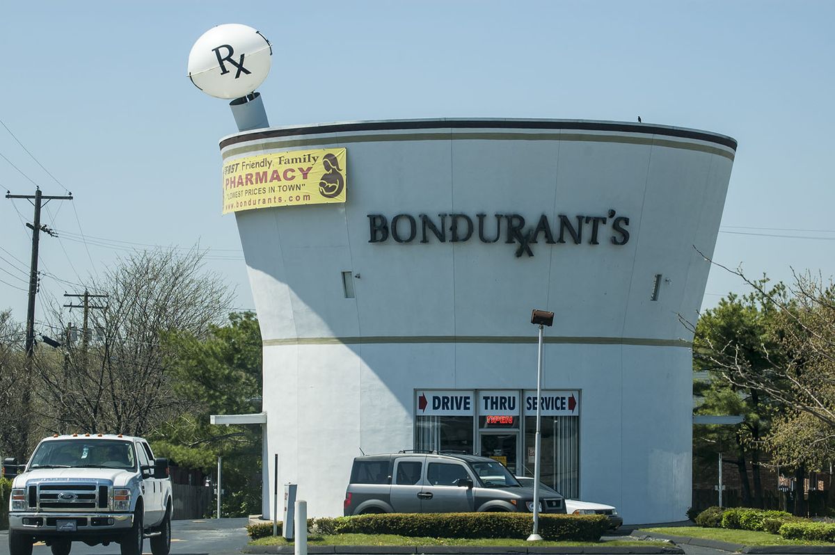 <p>The <a href="https://www.atlasobscura.com/places/bondurants-pharmacy">Bondurant's Pharmacy</a> building in Lexington, Kentucky is just 32 feet wide and 30 feet tall, but its quirky shape (it was originally designed to look like a mortar and pestle) has made it famous. Opened in 1974 as a pharmacy, today the building houses a liquor store and has been <a href="https://www.roadsideamerica.com/tip/528">made over to resemble a cocktail</a>.</p>