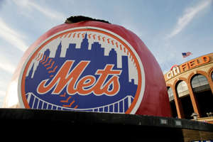 a close up of a sign: The Mets logo at Citi Field.