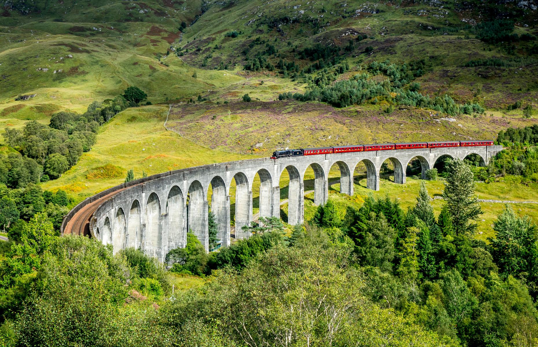 <p>Located in the stunning Scottish Highlands, the Glenfinnan Railway viaduct is one of Scotland’s most famous landmarks. Completed in the early 20th century, the 1,000 foot long (305m) arched structure stretches across the River Finnan near <a href="https://www.loveexploring.com/news/72416/things-to-do-in-fort-william-the-outdoor-capital-of-britain">Fort William.</a> With its magical setting, the marvellous feat of engineering has been featured in numerous Harry Potter films as the iconic Hogwarts Express. The Jacobite Steam train loops between Fort William and Mallaig through the scenic countryside and is often considered one of the best railway journeys in the world. </p>  <p><strong><a href="https://www.loveexploring.com/galleries/105935/these-are-the-uks-most-beautiful-train-stations?page=1">These are the UK’s most beautiful train stations</a></strong></p>