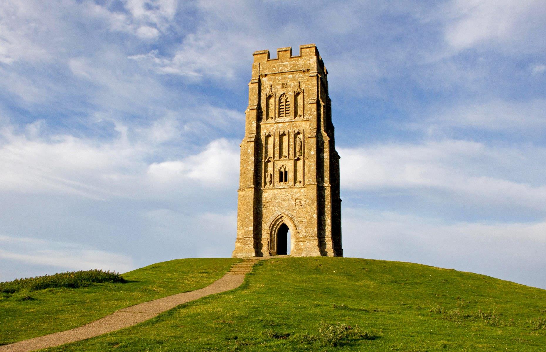 Overlooking Somerset’s scenic countryside, Glastonbury Tor has been one of Britain’s most spiritual sites for Pagans and Christians for over 1,000 years. Linked to myths and legends, it’s thought that beneath the hill there is a hidden cave that you can pass through into the fairy realm of Annwn. The beautiful remains of the 14th-century church of St Michael tower over its grassy summit, offering sweeping panoramas across the tranquil landscape.