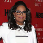 Oprah Winfrey holding a sign