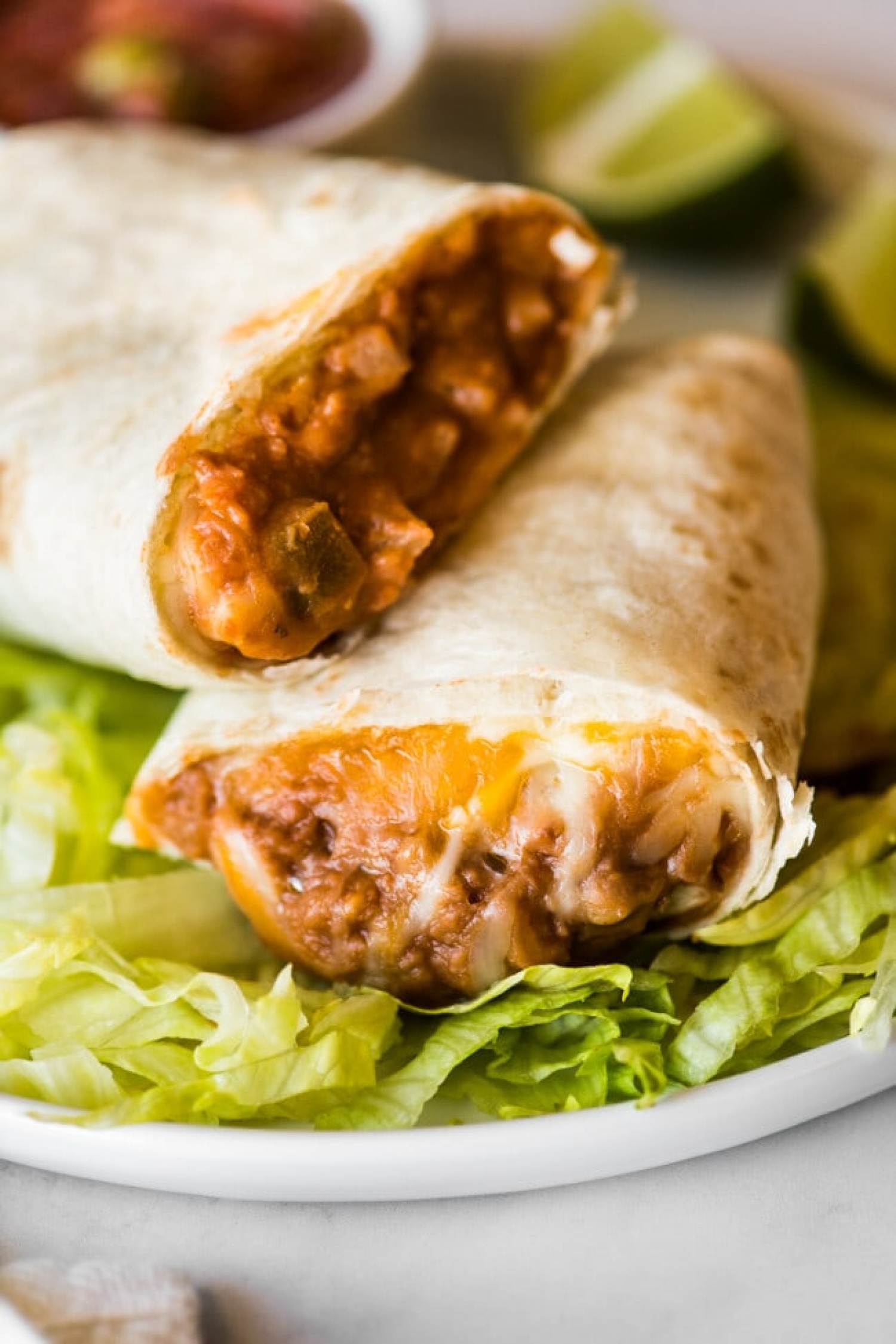 <p>Nothing beats the simplicity and tastiness of bean and cheese burritos, and there's no need to head to the nearest drive-thru to satisfy your cravings. <a href="https://www.isabeleats.com/bean-and-cheese-burritos/" rel="noopener">This recipe</a> comes together in less than 30 minutes, thanks to canned refried beans and a bunch of other pantry staples that cook up in your oven to cheesy perfection.</p>