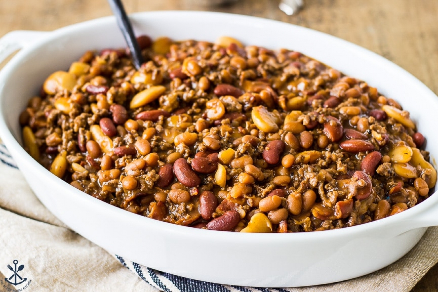 <p>Canned pork and beans, light red kidney beans and butter beans are the 3-bean base for this hearty bake that also has ground beef and bacon for good measure. All you have to do is pre-cook the meats, then dump everything in a pot and into the oven it goes! <a href="https://thebeachhousekitchen.com/baked-three-bean-casserole/" rel="noopener">Get the recipe here.</a></p>