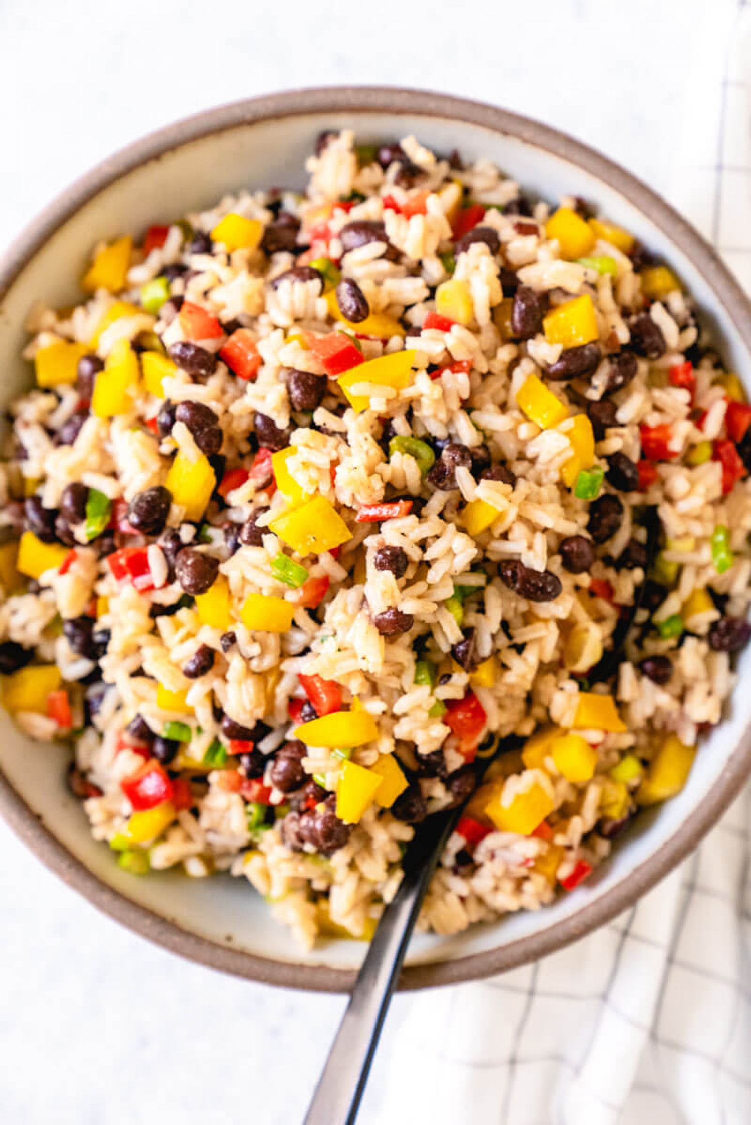 <p>For your next island-inspired meal or cookout, serve up this refreshing black bean salad with rice, crispy veggies and a tangy vinaigrette. It also provides a great way to use up leftover cooked rice! <a href="https://www.acouplecooks.com/caribbean-black-bean-salad/" rel="noopener">Get the recipe here.</a></p>