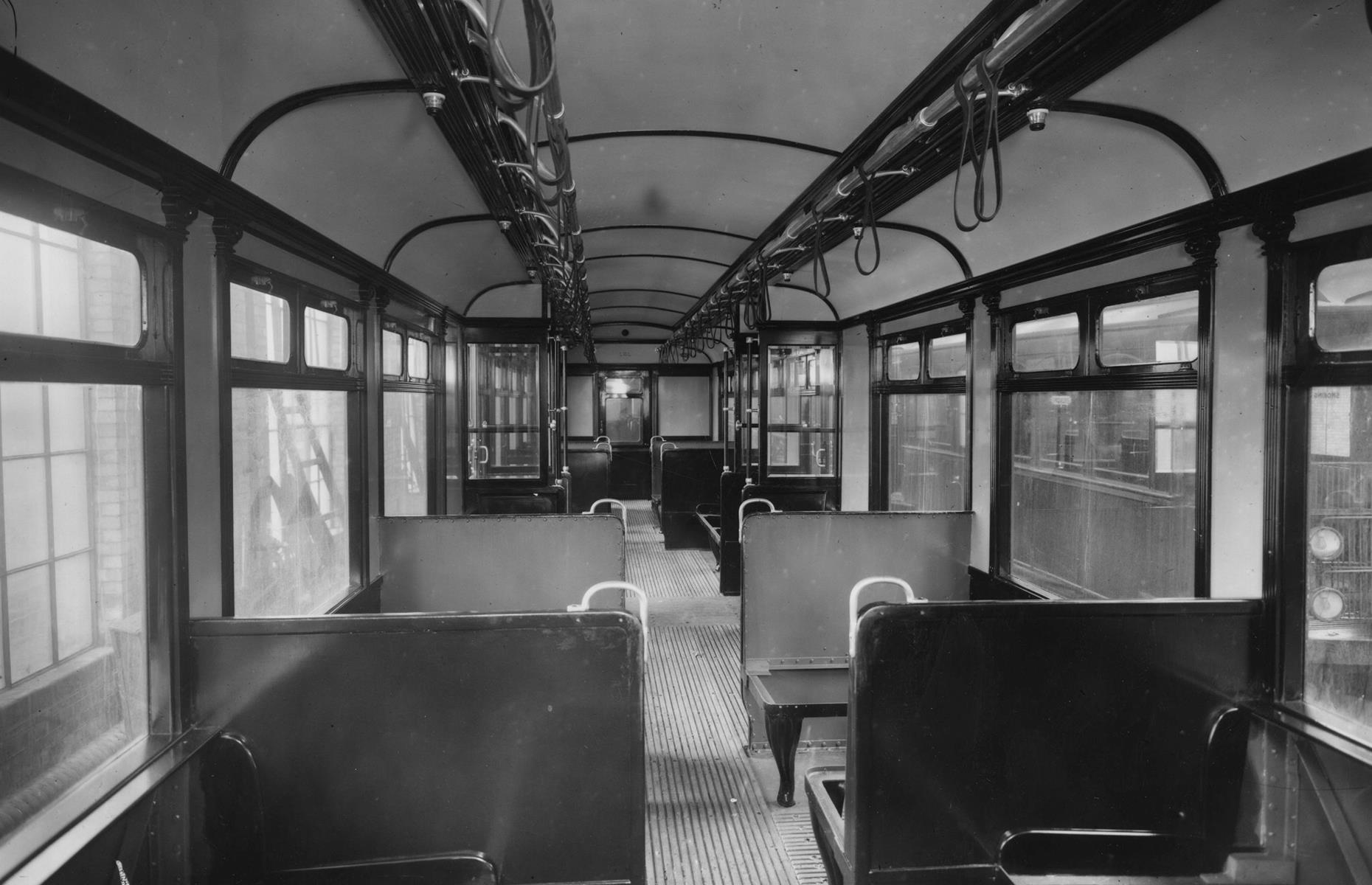 This vintage image shows a railway carriage on the newly electrified District Line in 1911. At first glance, the sparse car is not so different to those we're familiar with today. But check out the vast windows and wooden flooring – not to mention those solid-looking seats.