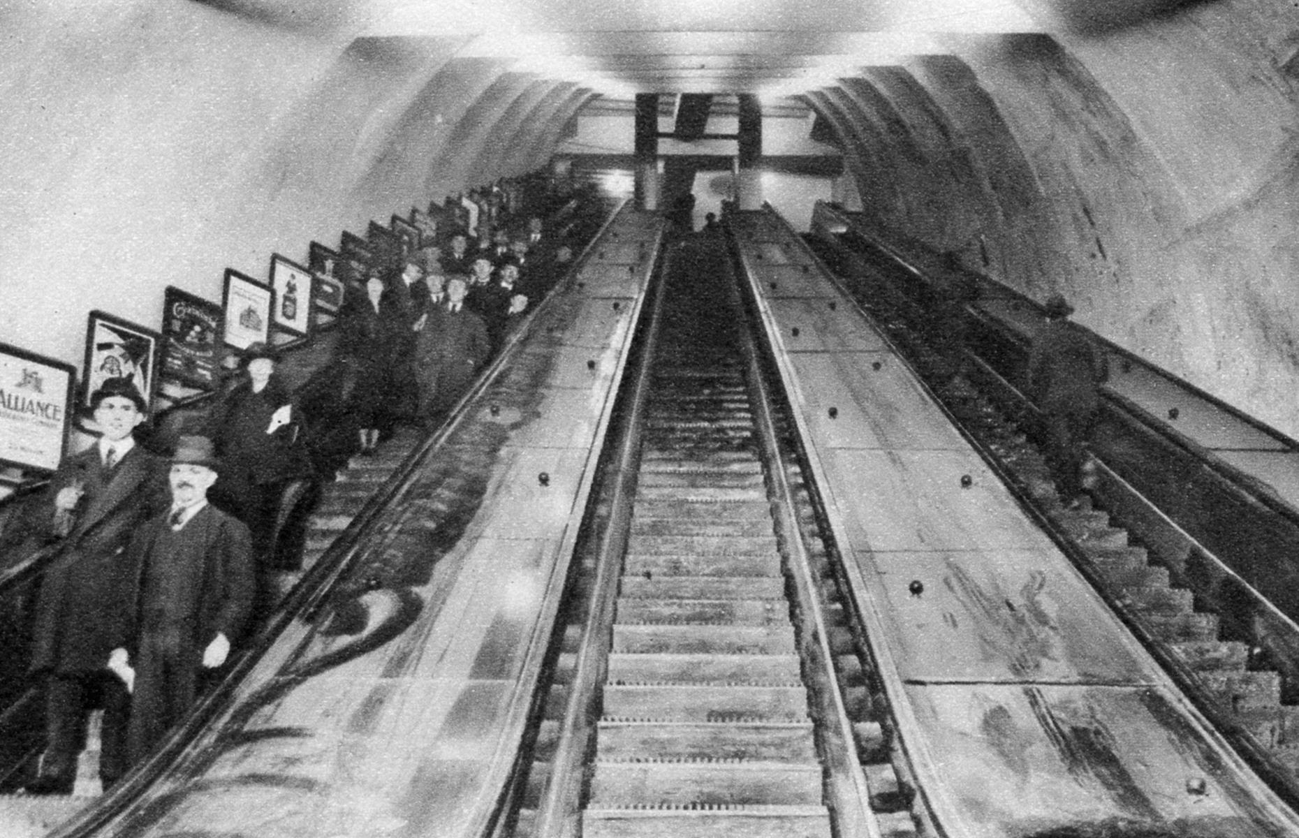 <p>Escalators were a novelty in the early 20th century. The first escalator was introduced to the London Underground at Earl's Court station in 1911. Commuters are pictured here in the mid-1920s riding down an escalator at London's Tottenham Court Road station. You can spot charming vintage ads lining the wall next to them.</p>  <p><strong><a href="https://www.loveexploring.com/galleries/104011/incredible-images-of-cruising-through-the-ages">Take a look at these amazing photos of cruising through the ages</a></strong></p>