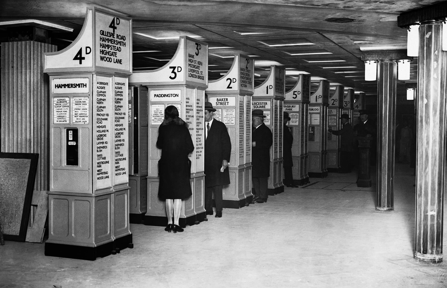 By the 1920s, more automated ticket stations were springing up across the network. Although they were state-of-the-art at the time, these vintage systems look pretty clunky to modern-day travelers. Passengers are shot here collecting tickets at Piccadilly, shortly after the station was expanded in 1928.