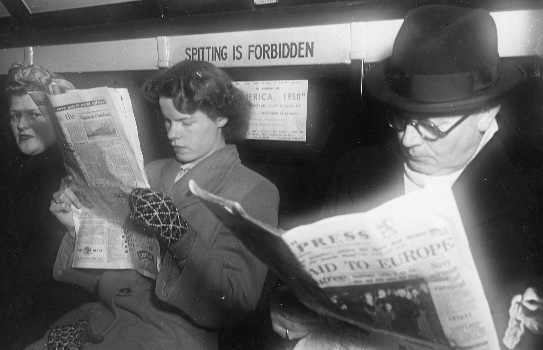 The Glasgow Subway is one of the oldest underground metro networks in the world – second only to London and Budapest. The Scottish system opened way back in 1896, but here's a snapshot of it decades later, in 1950. Passengers on board are absorbed in their newspapers and a bold "no spitting" sign grabs attention.
