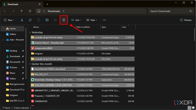 Screenshot of the Downloads folder on Windows 11 with multiple files selected and the delete button highlighted