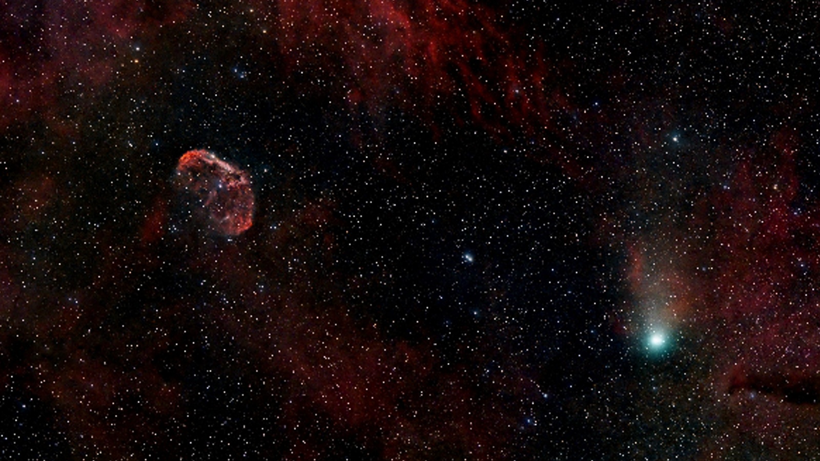 explosive, green 'devil comet' photobombs ethereal nebula as it races toward earth