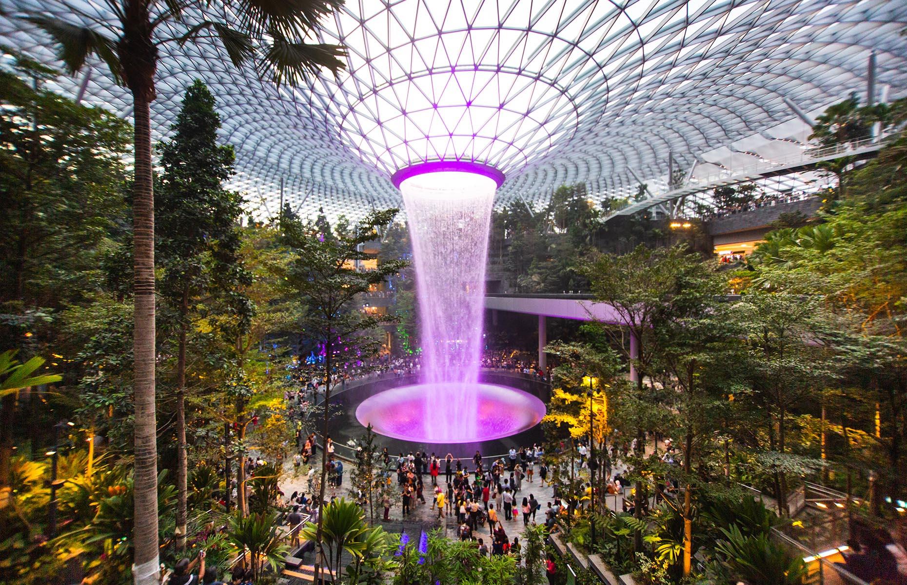 <p>It’s unusual to want to spend a whole lot of time at the airport on holiday, but the Jewel at Changi is a day out with a difference. Connected to the arrivals hall in Terminal 1 since 2019, this incredible nature-themed retail, dining and entertainment complex has to be seen to be believed. The first thing that will blow you away is the magnificent Rain Vortex, which stands at a whopping 131 feet (40m) and is the world’s tallest indoor waterfall. If you can tear yourself and your camera away from its unique lightshow, go wild in the hundreds of shops, while youngsters are equally catered for on the top floor, where two mazes, bouncing nets and giant slides await. It beats trailing around duty free, but don’t get distracted and miss your flight!</p>