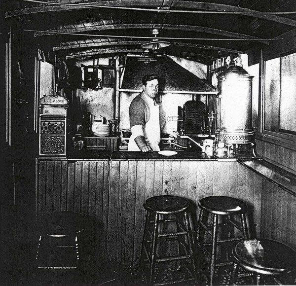 It is said that Louis Lassen served a hurried customer a grilled blend of steak trimmings between two slices of bread at his famed establishment <a href="http://louislunch.com/history/">Louis' Lunch</a> in New Haven, Connecticut, in 1900. According to Louis loyalists, <em>that</em> is when the hamburger was invented. The famous sandwich is still served at the <a href="https://blog.cheapism.com/bucket-list-restaurants-16350/">iconic American eatery</a>, cooked on the same vertically aligned cast iron grills popular in the 1890s.<p>Cheese, tomato, and onions are the only acceptable garnishes — don't even think of asking for ketchup and mustard. A common order, in "Louis' Lingo," is "cheese works, salad, and a birch" which translates to a cheeseburger sandwich with all the toppings, a side of potato salad, and the restaurant's popular birch beer soda.</p><p><b>Related:</b> <a href="https://blog.cheapism.com/historic-sandwich-shops/">20 Historic Sandwich Shops That Changed Lunch Forever</a></p>