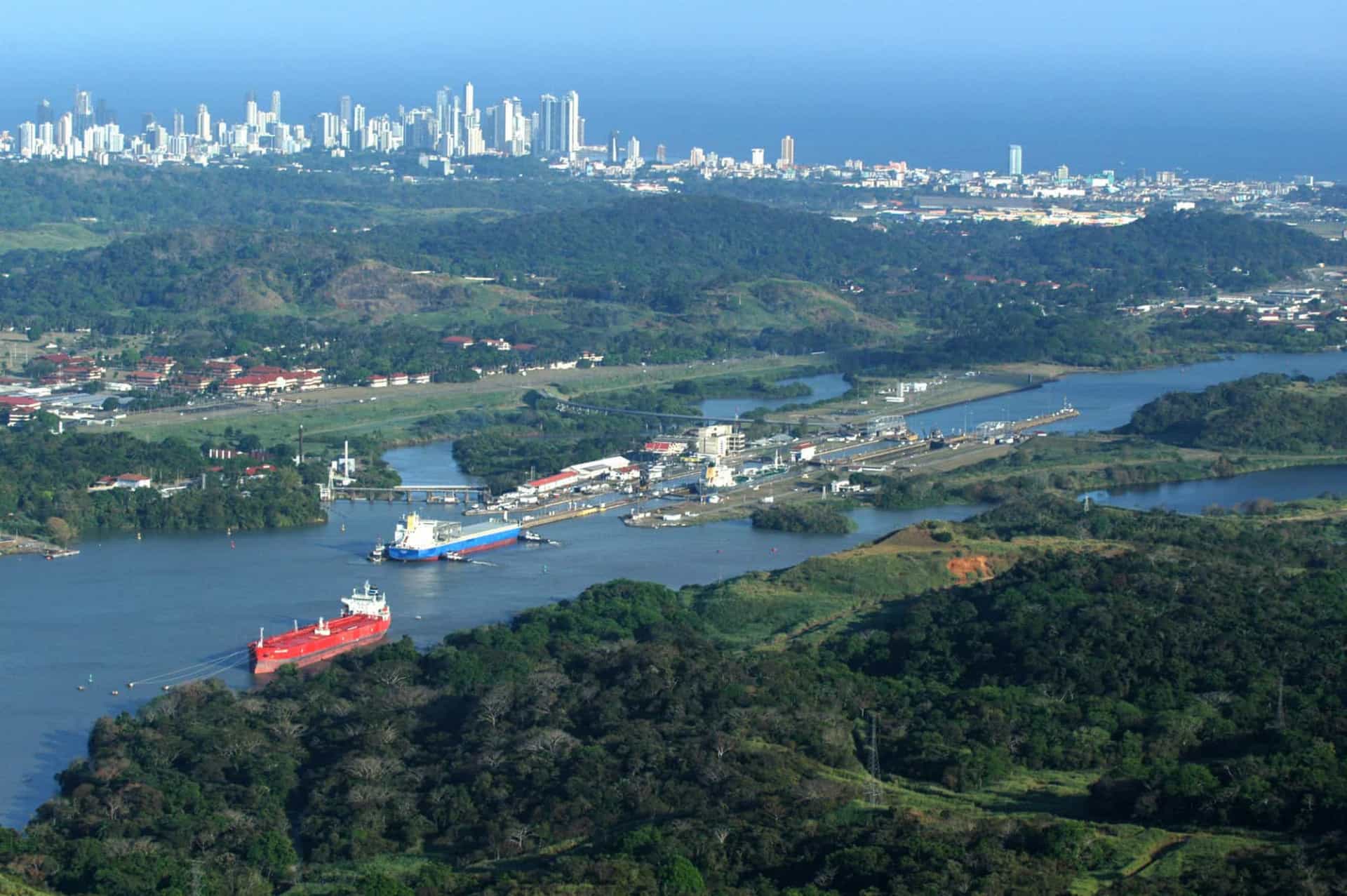 <p>Pictured are ships crossing Miraflores Locks in the Pacific end of the Panama Canal. Panama City is visible in the background.</p>
