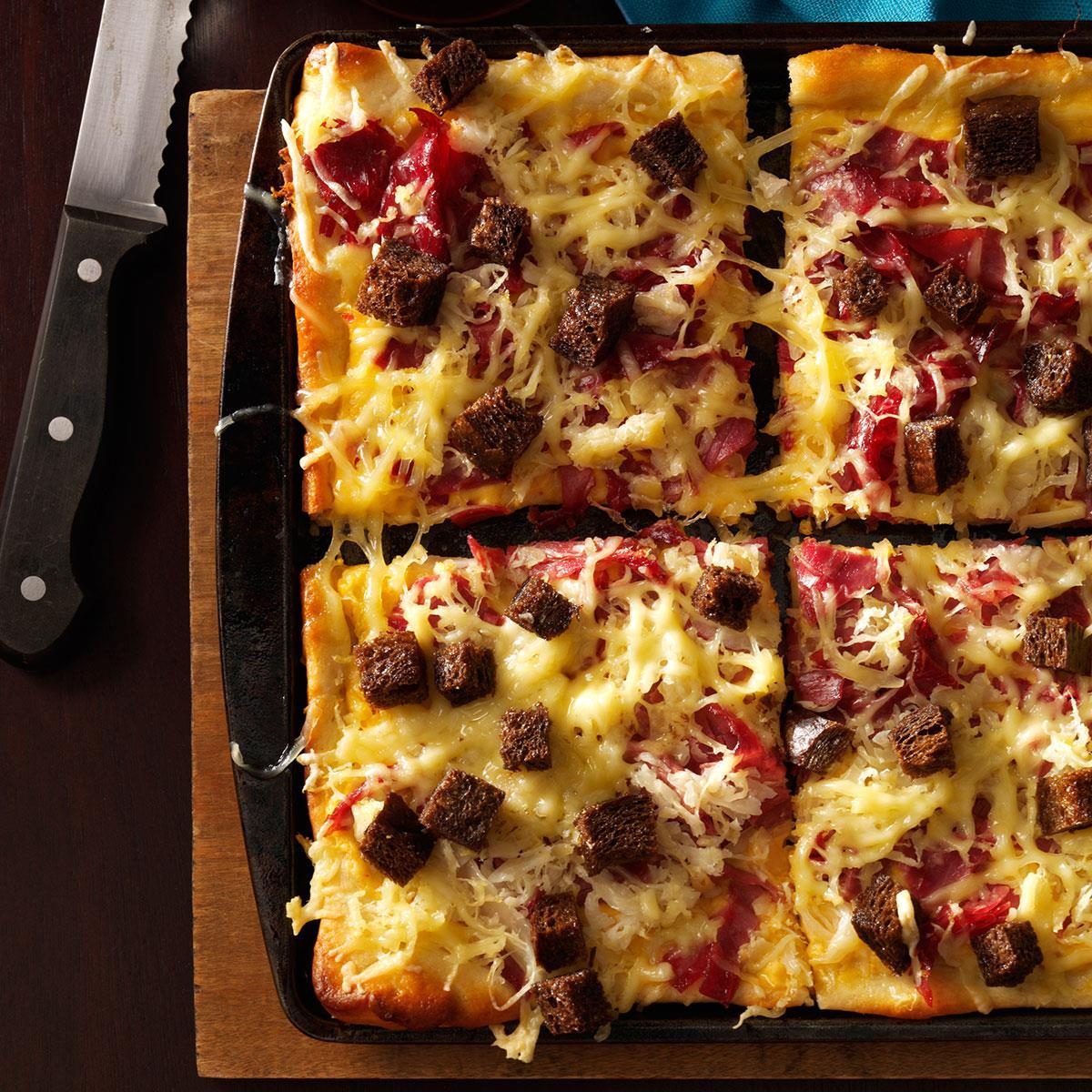 <p>I love a good Reuben sandwich and thought, “Why not make it into a pizza?” It's got extra cheesy goodness in the sauce, and smells wonderful coming out of the oven. —Tracy Miller, Wakeman, Ohio</p> <div class="listicle-page__buttons"> <div class="listicle-page__cta-button"><a href='https://www.tasteofhome.com/recipes/reuben-style-pizza/'>Get Recipe</a></div> </div>