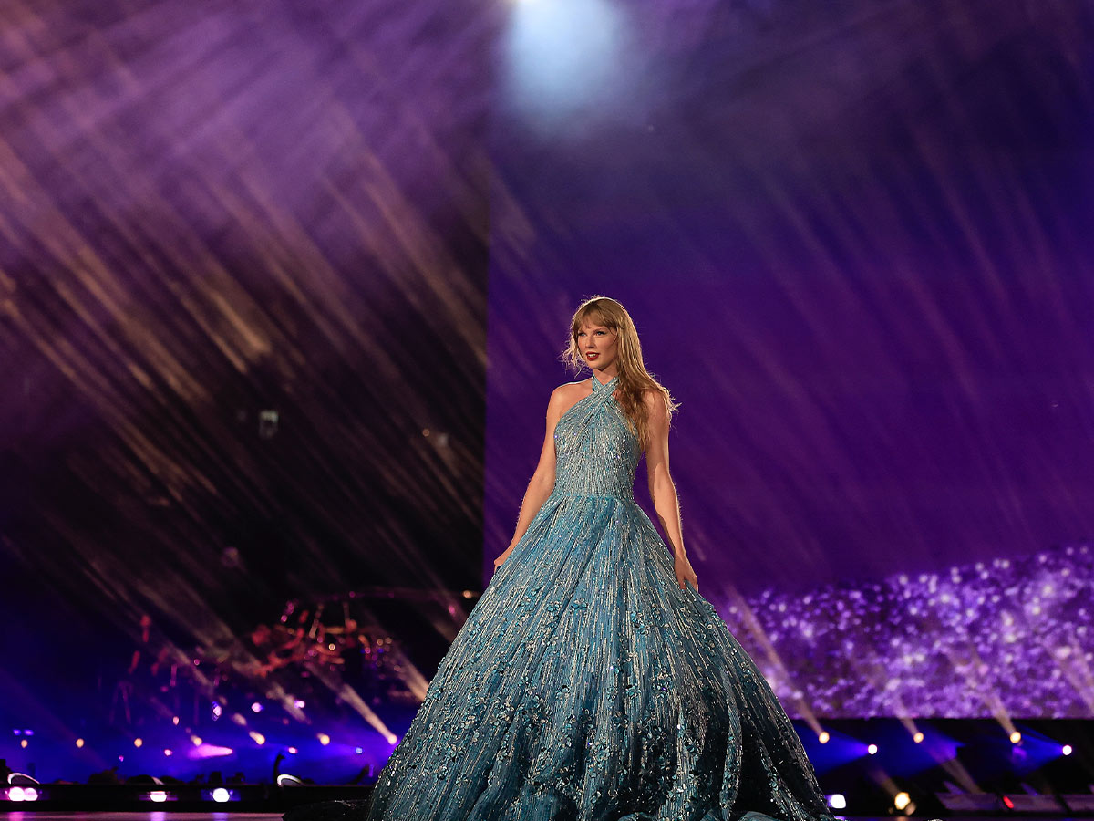 <p>Staying on theme with the night's <em>1989 (Taylor's Version)</em> announcement, Taylor switched up her usual purple Enchanted gown for a blue Nicole + Felicia one.</p> <p>And of course, she had a matching blue guitar to complete the ensemble.</p>