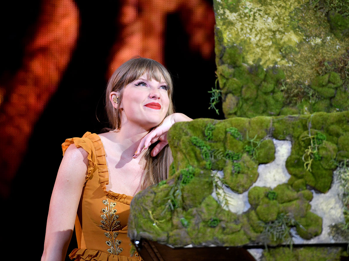 <p>Taylor's <em>Evermore </em>set is a true treat for Swifties. Taylor dons her yellow Etro dress during the whimsical era, and even adds a matching Etro cape for the performance of "Willow."</p> <p>She also takes to the piano for a few numbers—and her microphone changes from bedazzled to seemingly wooden.</p>