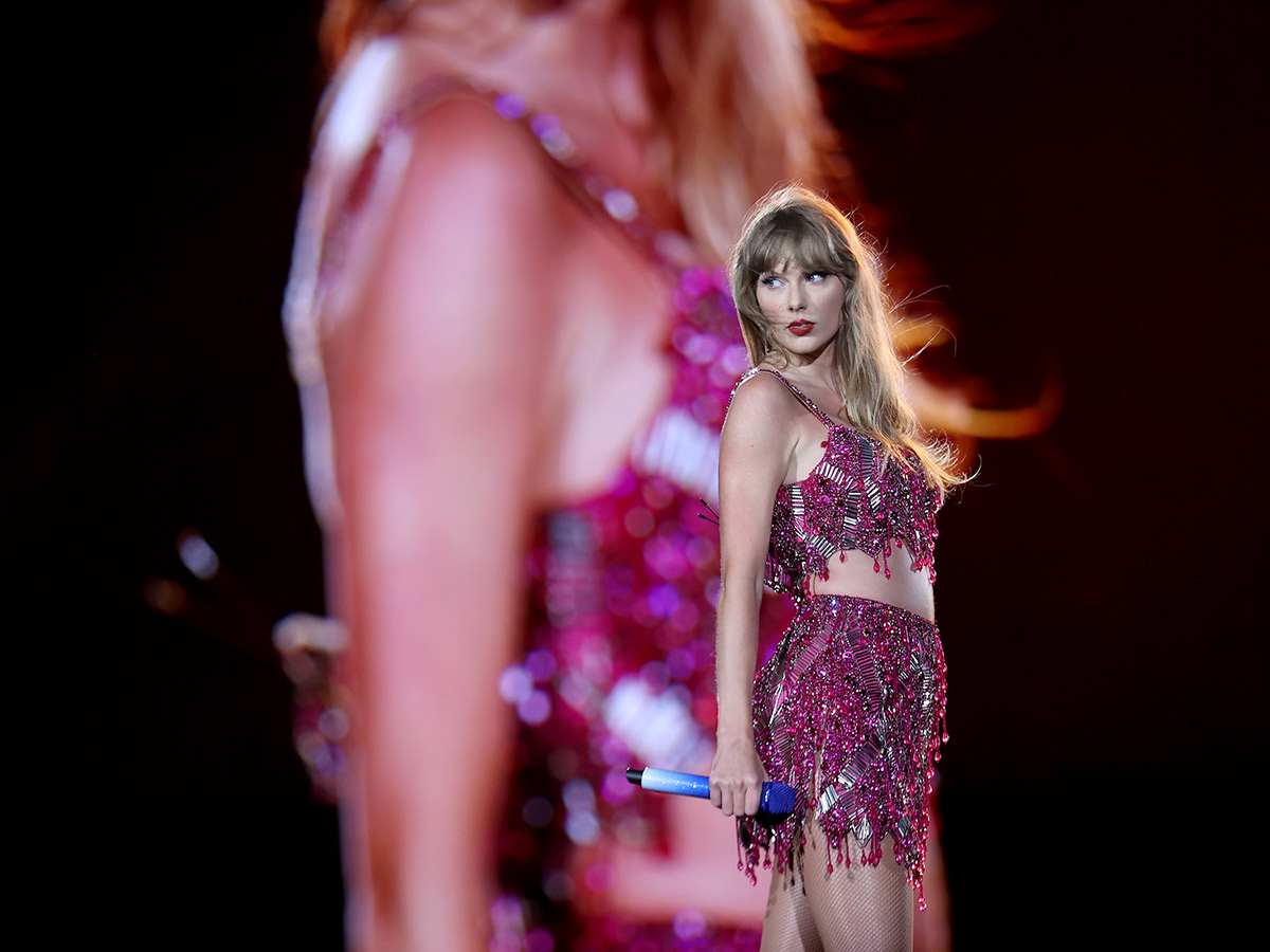 <p>Another look at Taylor's iconic Roberto Cavalli two-piece, sequined set for her 1989 Era, complete with a 1989-blue microphone.</p>