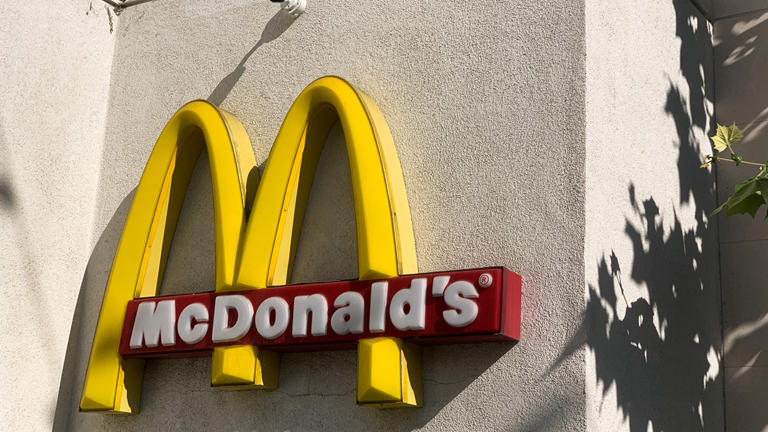 The McDonald's logo is seen near the restaurant in Santa Monica, California on November 13, 2023. McDonald's franchisee owner Scott Rodrick revealed that California's new minimum wage law has placed multiple economic hardships on his restaurants. Getty Images