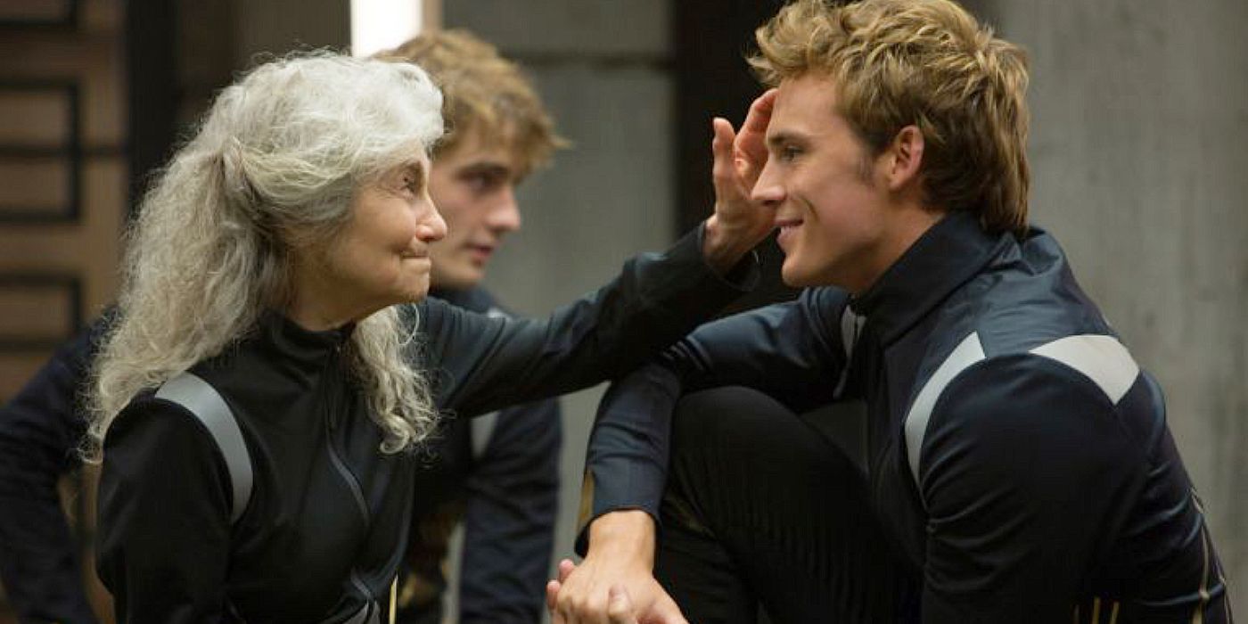 <b>Finnick</b> and Mags smiling at each other in The Hunger <b>Games</b>.