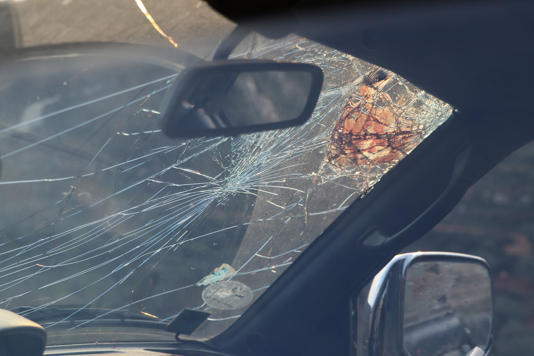 Blood smeared on the broken windshield of the car Tawfic Hafeth Abdel Jabbar was in when he was shot. (Chantal Da Silva)