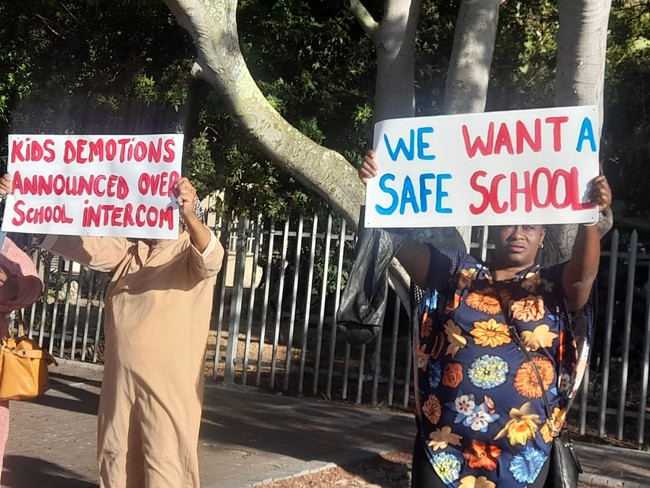 parents picket outside a high school in goodwood over public demotion announcement