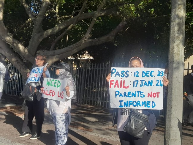 parents picket outside a high school in goodwood over public demotion announcement