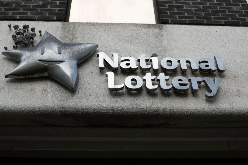 lottery to change adverts after complaint about unclaimed prizes 'going back to the community'