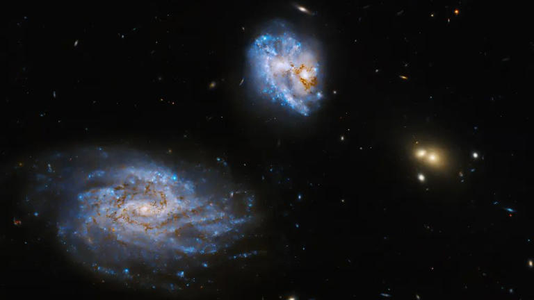 Hubble Space Telescope Sees Colliding Galaxies Aglow With Stars 