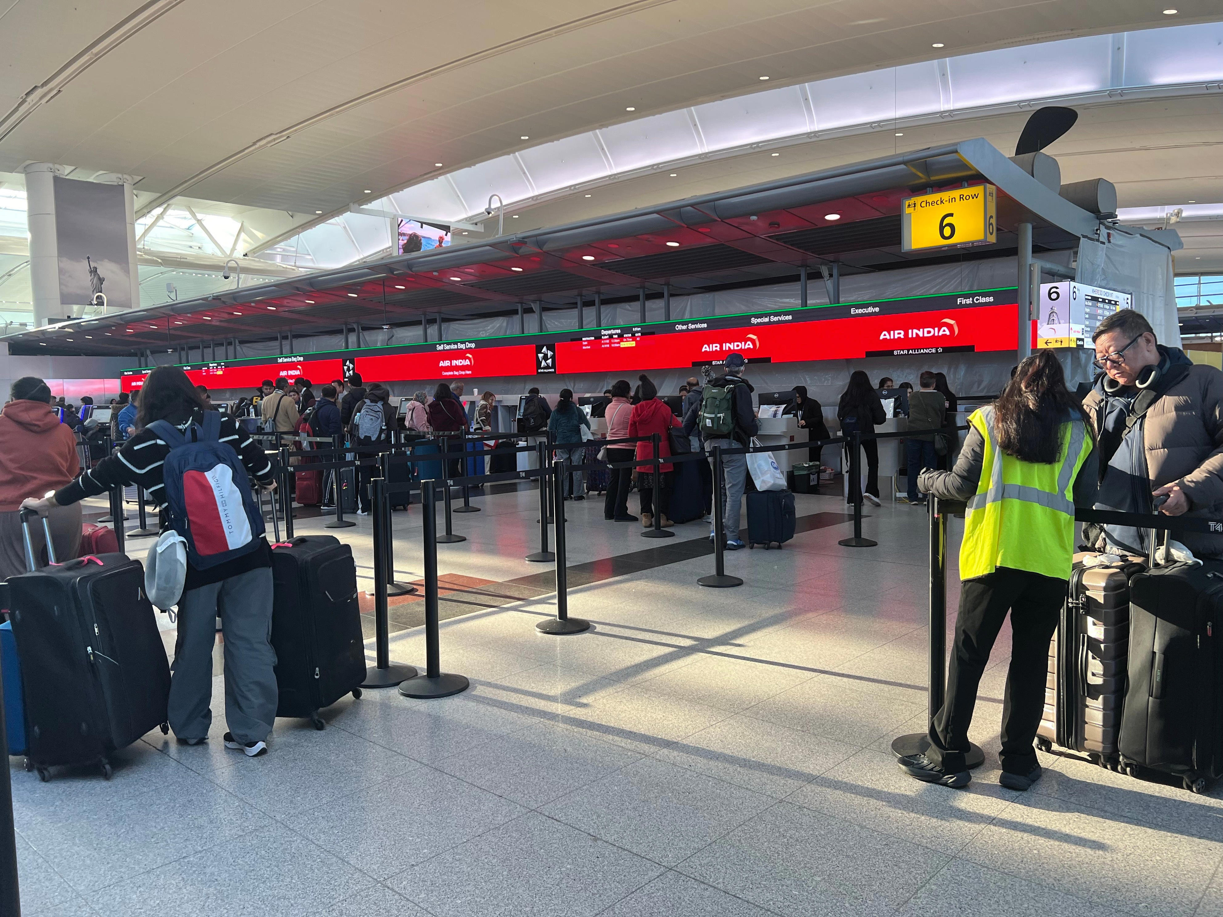 <p>The display lining along the back of the check-in area showed Air India's new logo and color scheme and flight information for routes to Delhi and Mumbai.</p>