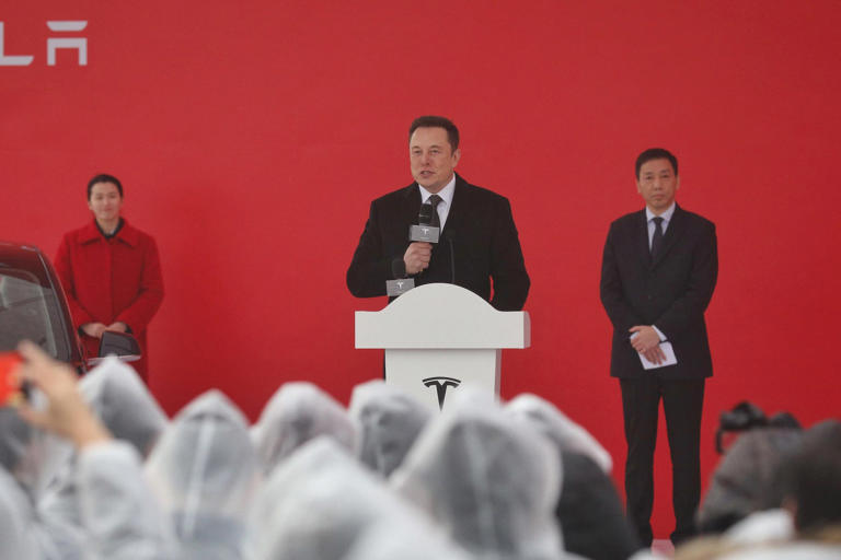Elon Musk speaks at the site of Tesla's Shanghai gigafactory in 2019. STR/Getty Images