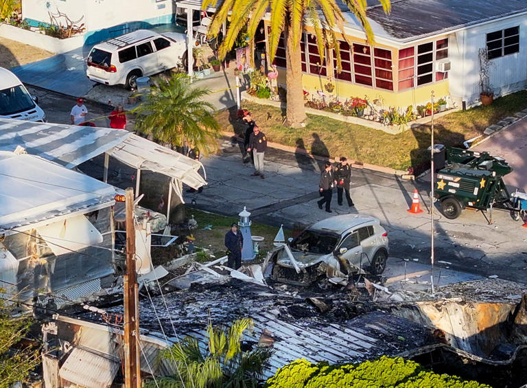 Plane crashes into waterfront mobile home park killing three