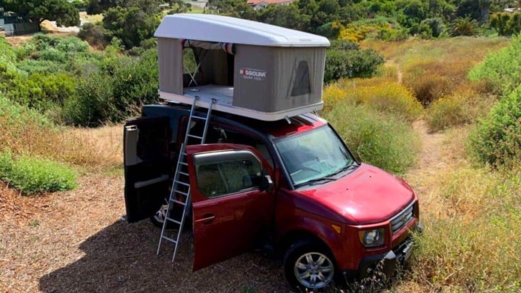 <p>The <a href="https://www.thewaywardhome.com/honda-element-camper/">Honda Element</a> is a cult SUV camper popular among van lifers all over the U.S. The model was discontinued in 2011, yet more and more people have decided to convert used ones into campers in the last few years.</p><p>Thanks to its boxy shape and unusual bi-parting doors, it’s easy to recognize. The design is based on a lifeguard station. Yet, it looks just like a car, making it very stealthy.</p><p>Buying a used Honda Element is super economical – some models are as cheap as $3,499. It also comes in four-wheel drive, so you can also take it on some fun off-road adventures. Unlike other minivans, the cab of the Element is quite tall, which means you can get changed inside without having to sit down. Sitting up in bed is comfortable, too.</p>
