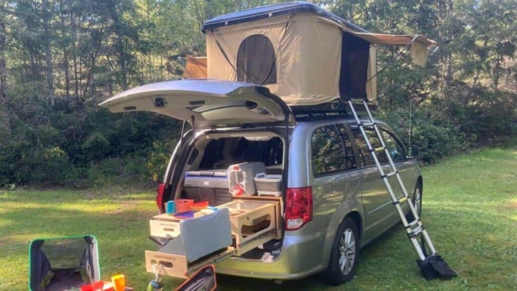 <p>If you prefer the lower profile of a minivan, check out the <a href="https://www.thewaywardhome.com/dodge-grand-caravan-camper/">Dodge Grand Caravan.</a> While it looks like a car, it’s very long, offering plenty of legroom for sleeping.</p><p>It can sit up to 7 people and the size is impressive. It has a total length of 202.8 inches, 78.8 inches of width and a height of 67.9 inches. You can easily fit a double bed and a kitchen. The rear hatchback door allows you to cook at the back of the vehicle.</p><p>The Dodge Grand Caravan is an extremely well-liked car and camper with a long production history. For this reason, it’s easy to find replacement parts. However, it can be difficult to find a used one for sale.</p>