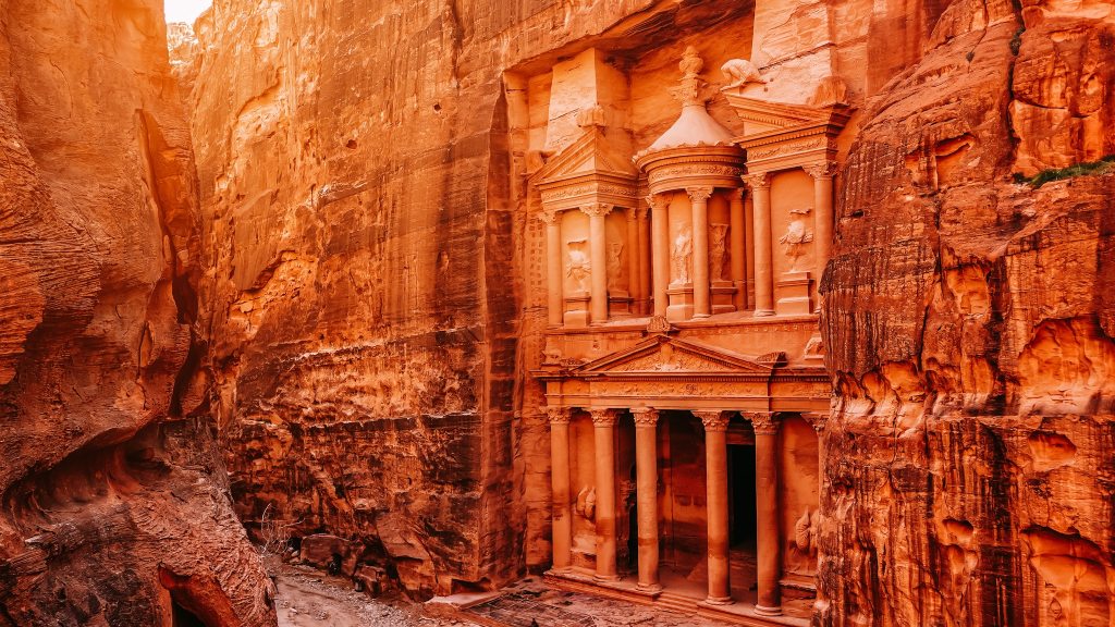 <p>Petra is a breathtaking archaeological site carved into the natural rose-tinted sandstone cliffs and is Jordan’s most popular tourist attraction. The site lies in the desert southwest of Jordan, dating back to around 300 B.C. Al Khazneh, also known as The Treasury, is a Greek-style temple, and Petra’s most iconic sight. </p><p class="has-text-align-center has-medium-font-size">Read also: <a href="https://worldwildschooling.com/most-stunning-coastal-drives-in-the-world/">Coastal Drives Around the World</a></p>
