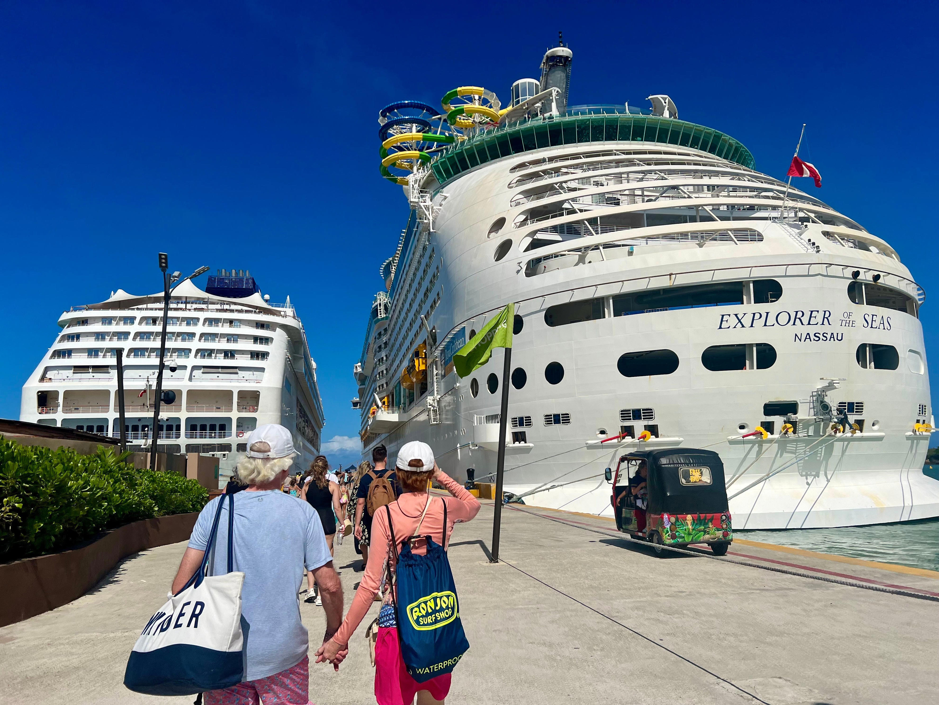 <p>We docked next to a giant Royal Caribbean ship with slides and other amenities poking out of its deck.</p>