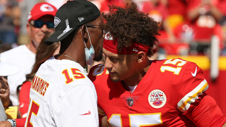 Chiefs quarterback Patrick Mahomes hugs his dad before an AFC West matchup against the Los Angeles Chargers on Sept. 26, 2021, at GEHA Field at Arrowhead Stadium in Kansas City. Scott Winters/Icon Sportswire via Getty Images