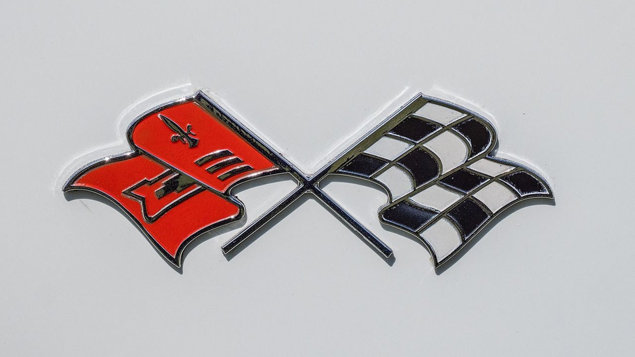<p>Have you ever seen the original 1953 Corvette logo? Notice something different? When the car first came out, the logo featured an American Flag. It was changed to the classic checkered and red fleur-de-lis design after issues with using the American flag for commercialization popped up. </p>