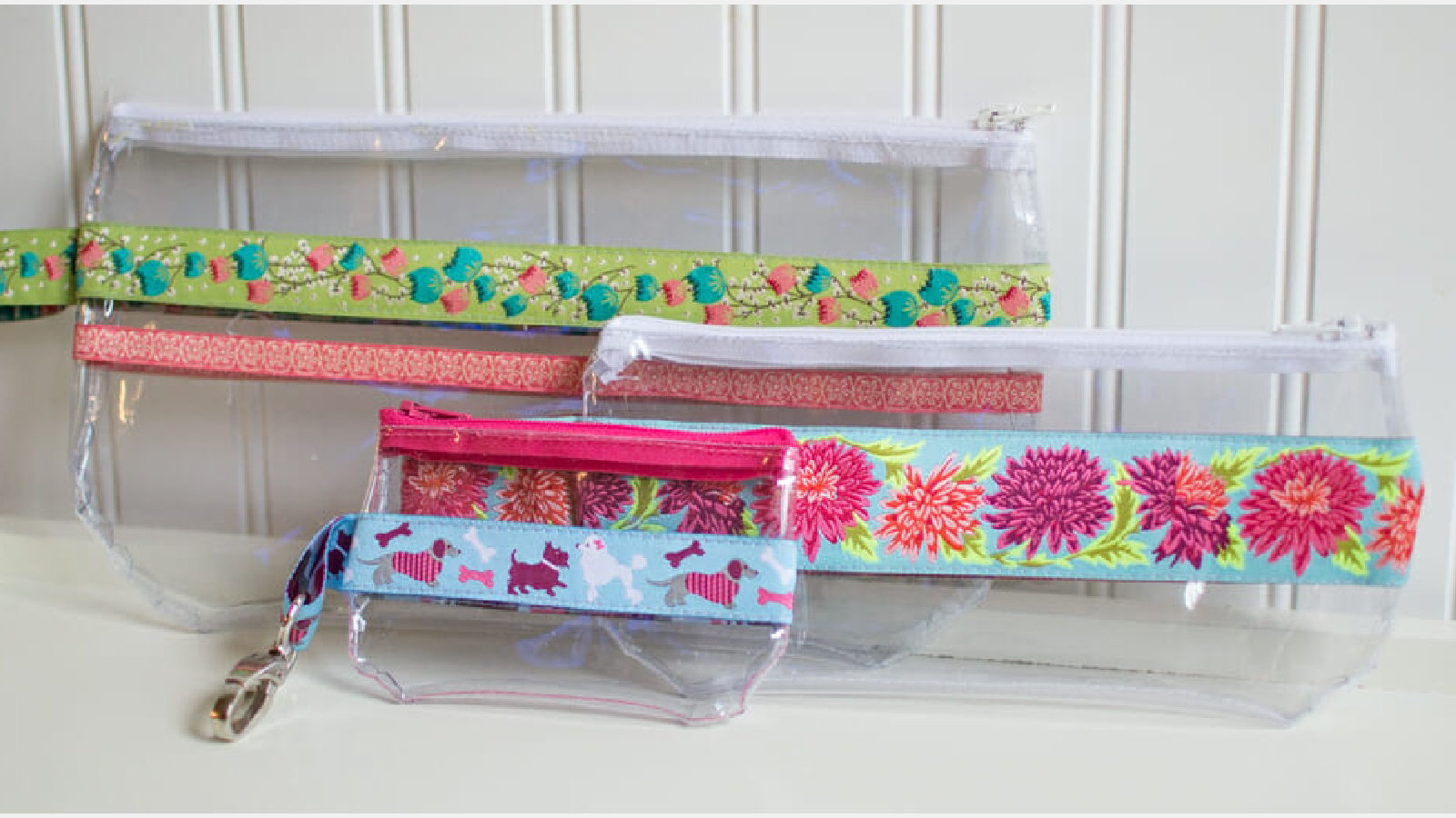 <p>Lots of people ask for see-through zipper bags for travel, and this <a href="https://sewcanshe.com/2014-8-17-ribbon-and-vinyl-zipper-pouches-free-tutorial/" rel="noreferrer noopener">Ribbon and Vinyl Zipper Pouch Pattern</a> is the easist one. </p><p>If you are worried about sewing on the vinyl… <em>don’t be!  </em>The tutorial contains a great technique for using tissue paper so the vinyl will move smoothly across your sewing machine bed. You might like these <a href="https://www.sewcanshe.com/blog/tips-for-sewing-on-vinyl?rq=sewing%20with%20vinyl" rel="noreferrer noopener">Tips for Sewing on Vinyl.</a></p>
