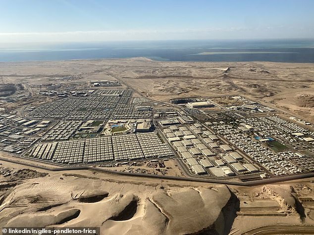 new aerial pictures show staggering scale of saudi construction site for futuristic $1trillion city the line with vast chasm carved through mountains in preparation for 75-mile-long skyscraper mega-project