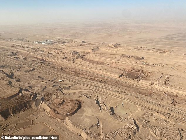 new aerial pictures show staggering scale of saudi construction site for futuristic $1trillion city the line with vast chasm carved through mountains in preparation for 75-mile-long skyscraper mega-project