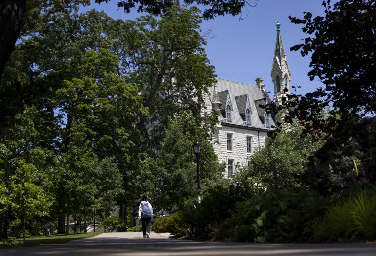 A person walks through campus at Northwestern University on July 10, 2023, in Evanston.