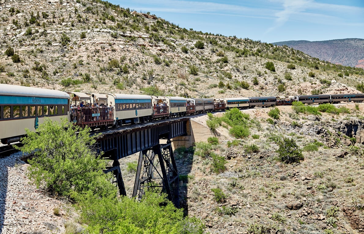 <p><strong>The trip</strong>: The <a href="https://verdecanyonrr.com/">Verde Canyon Railroad</a> is a vintage, refurbished train in Arizona that travels from <a href="https://verdecanyonrr.com/journey/in-the-canyon/">Clarkdale to Perkinsville and back</a>. The railroad calls this area the “other grand canyon” of Arizona. Riders can view red rock pinnacles and ancient Native American ruins, and ride through a 734-foot manmade tunnel that was carved out more than a century ago.</p> <p><strong>How long it takes</strong>: Four hours</p> <p><strong>To learn more or book tickets</strong>: Visit the <a href="https://verdecanyonrr.com/">Verde Canyon Railroad</a> website</p> <h3>Try a newsletter custom-made for you!</h3> <p>We’ve been in the business of offering money news and advice to millions of Americans for 32 years. Every day, in the <a href="https://www.moneytalksnews.com/?utm_source=msn&utm_medium=feed&utm_campaign=blurb#newsletter" rel="noopener">Money Talks Newsletter</a> we provide tips and advice to save more, invest like a pro and lead a richer, fuller life.</p> <p>And it doesn’t cost a dime.</p> <p>Our readers report saving an average of $941 with our simple, direct advice, as well as finding new ways to stay healthy and enjoy life.</p> <p><a href="https://www.moneytalksnews.com/?utm_source=msn&utm_medium=feed&utm_campaign=blurb#newsletter" rel="noopener">Click here to sign up.</a> It only takes two seconds. And if you don’t like it, it only takes two seconds to unsubscribe. Don’t worry about spam: We never share your email address.</p> <p>Try it. You’ll be glad you did!</p> <p class="disclosure"><em>Advertising Disclosure: When you buy something by clicking links on our site, we may earn a small commission, but it never affects the products or services we recommend.</em></p>