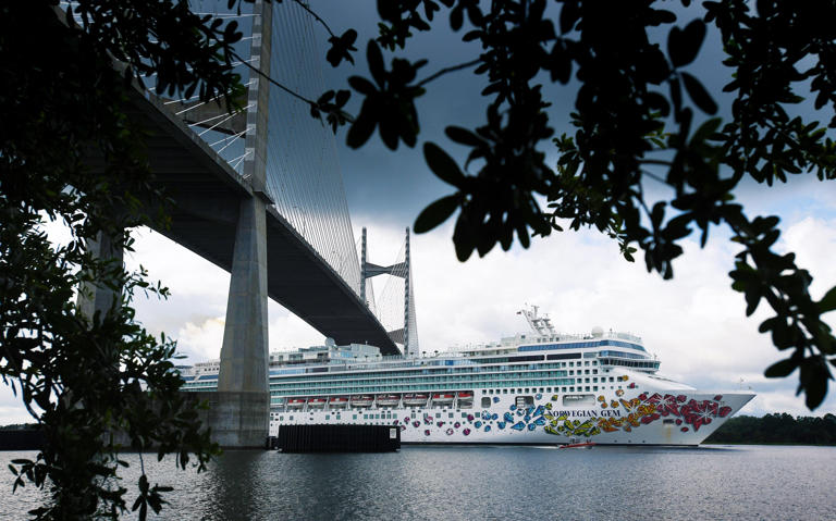 The Norwegian Cruise Line ship "Norwegian Gem" heads west down the Saint Johns River as it passes under the Dames Point bridge on May 27, 2020. Norwegian temporarily docked the Norwegian Gem and the Norwegian Sky in Jacksonville during the cruise shutdown that occurred during the COVID-19 pandemic. [Bob Self/Times-Union]