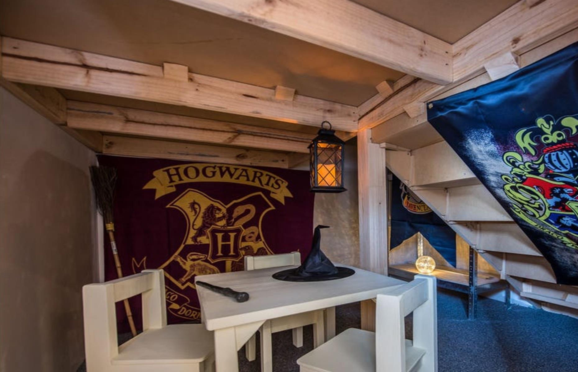 <p>That's right, the former owners of this pad decided to turn the redundant void below their stairs into the ultimate Hogwarts-themed retreat. Complete with a wand, wizard's hat, broom, fortune teller's orb, and lantern, the space is cozy, fun, and perfect for kids with bags of imagination.</p>
