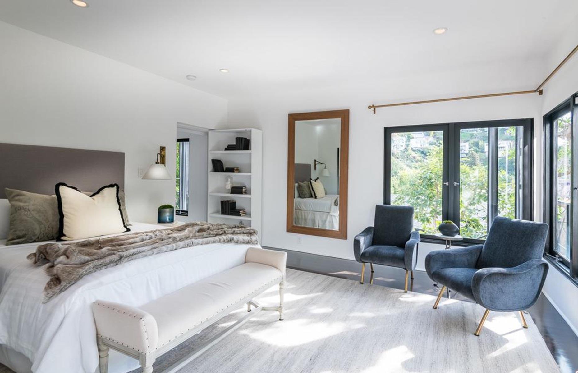 <p>According to <a href="https://www.redfin.com/CA/Los-Angeles/8850-Evanview-Dr-90069/home/7119967">the listing</a>, the calming bedroom was Garland's personal suite. The perfect place for a Hollywood icon to escape the paparazzi, relax, and unwind, the room benefits from a sitting area, a luxury private bathroom, and a set of French doors, which open onto a tranquil courtyard garden where Garland no doubt spent plenty of downtime.</p>