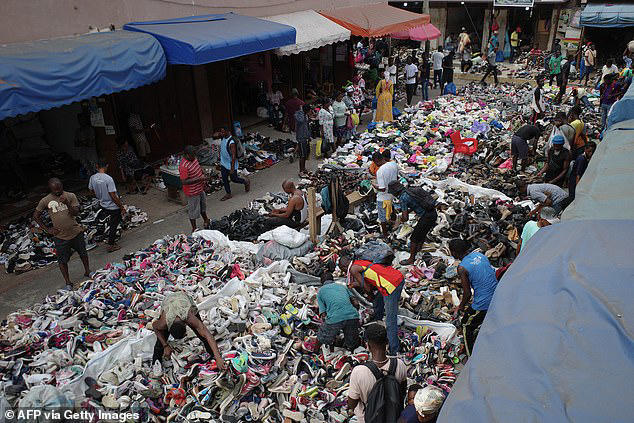 Mountains of clothes washed up on Ghana beach show cost of fast fashion