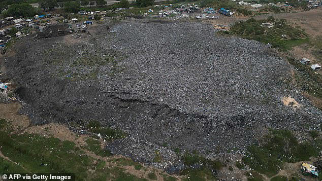 Mountains of clothes washed up on Ghana beach show cost of fast fashion