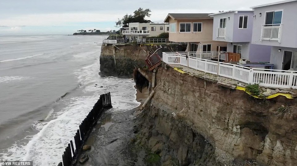 Storm topples homes off cliffs with nine dead in California